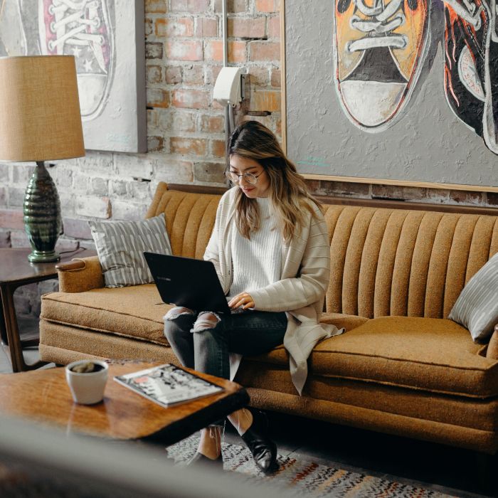 Woman working on a laptop in a café